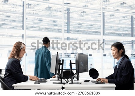 Using AI machine learning, computer monitor and multiracial team designing complex PCB layout, optimizing integrated circuit production, artificial intelligence and teamworking colleagues.