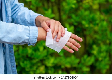 Using Antibacterial Wet Wipes For Disinfection Hands In Park 