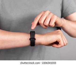 Using Black Smart Fitness Watch, Bracelet On Hand. High Quality Photo