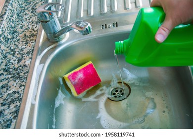 Using bleach to clean the dirty sink - Shutterstock ID 1958119741
