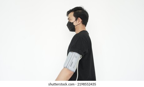 Using A Blood Pressure Check On The Arm While Wearing A Mask