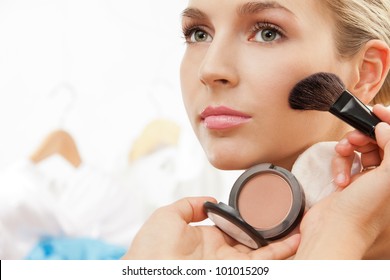 Using Blush Brush To Apply Blush On Cheeks - Professional Makeup Artist Working