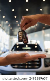 Using a car key as a means of exchange represents a transaction, signaling the acquisition of a vehicle