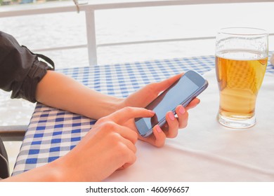 Using cellphone in the restaurant.