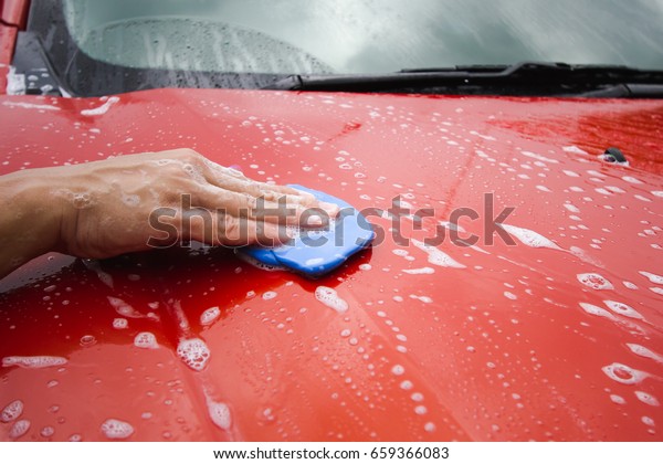 Using Clay Bar to clean car surface in Car\
detaing business.