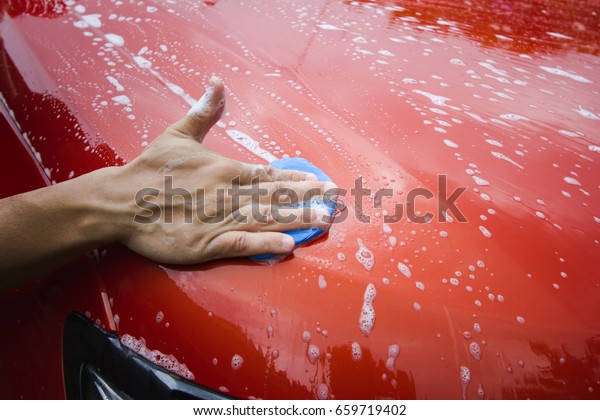 Using Clay Bar to clean car surface in Car\
detailing business.