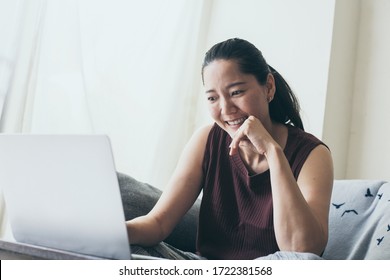 using computer.hand typing keyboard laptop online chatting search form internet while working sitting on sofa.concept for work from home.technology device contact communication business people - Shutterstock ID 1722381568