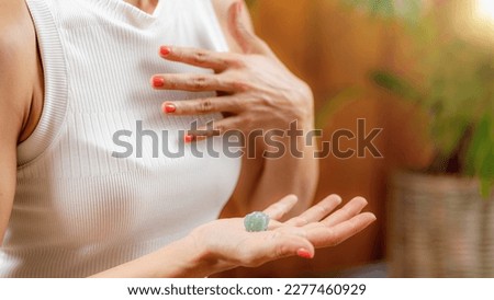 Using a crystal for improvement of energy circulation in Anahata, heart chakra. Chakras, energy centers in the body, govern certain physical, emotional and spiritual functions.  
