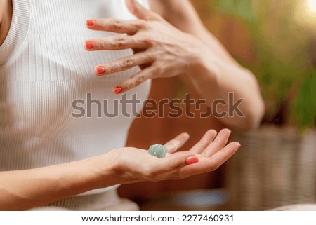 Using a crystal for improvement of energy circulation in Anahata, heart chakra. Chakras, energy centers in the body, govern certain physical, emotional and spiritual functions. 