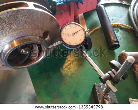 Using dial gauge check alignment of impeller
