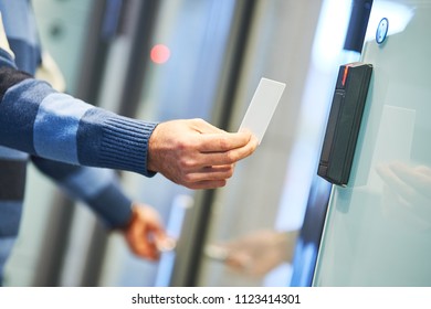 using electronic card key for access - Shutterstock ID 1123414301