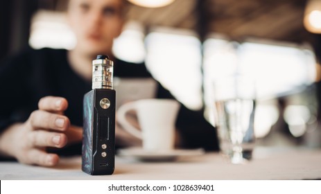 Using Electronic Cigarette To Smoke In Public Places.Smoke Restriction,smoking Ban.Using Vaping Device With Flavoured Liquid.E-juice Vaping New Technology.Give Up Tobacco.Smoking Habit,nicotine Addict