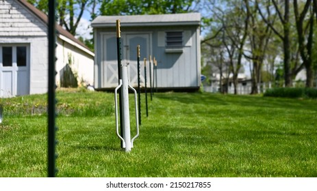 Using A Fence Post Driver To Install A T Post Wire Fence In A Yard