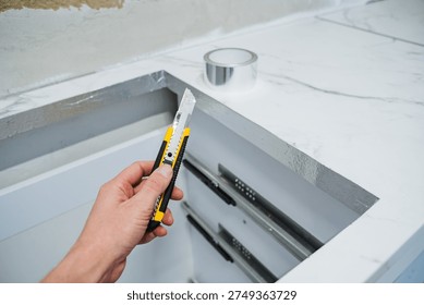 Using Hand Tools For Marble Cutouts. Precision Trimming Of Marble With Manual Cutting Tools. Detailed Process Of Removing Seam Sections From Marble Countertops Using Professional Techniques