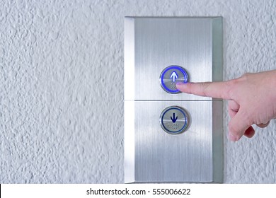 Using hands, press the elevator up and keypad elevator - Powered by Shutterstock