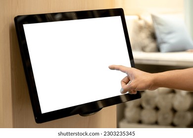 Using interactive touchscreen display in home decoration store. Male customer hand touching on LCD touch screen monitor on the wall for browsing information in furniture design shop. - Powered by Shutterstock