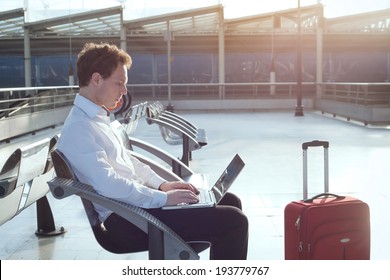 using internet in the airport terminal - Powered by Shutterstock