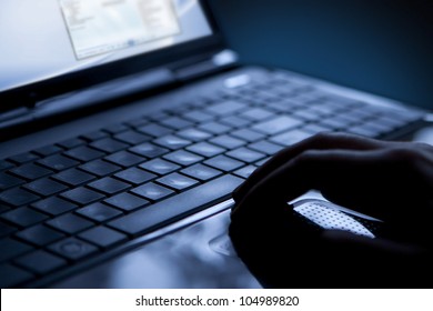 Using a laptop, finger on touchpad and keyboard - Shutterstock ID 104989820