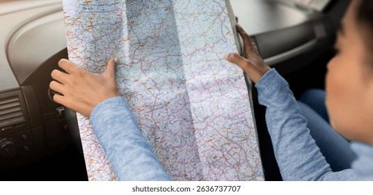 Using map in road trip for directions in new city at travel
