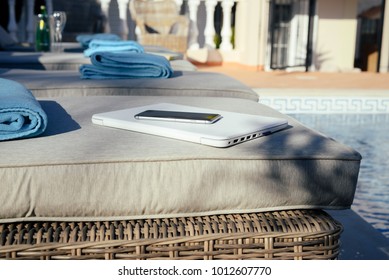 Using Mobile Smartphone On Sunny Holiday By Swimming Pool Outdoors Background. Close Up View Photo Of Leisure Luxury Lifestyle