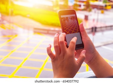 Using a mobile for taking photo.