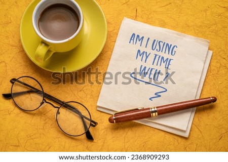 Am I using my time well? Self reflection question on a napkin. Productivity concept.
