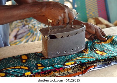 Using An Old Hot Coal Iron In West Africa