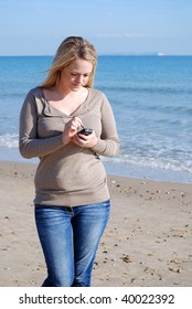 Using phone at the beach
