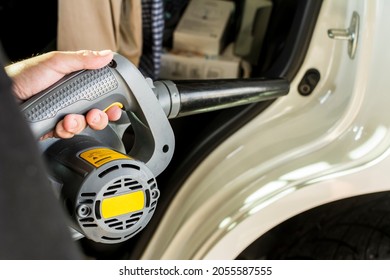 Using A Professional Air Blower To Dry The Car Door Jamb And Seal Exterior Below The C Pillar. Part Of Auto Detailing Service.