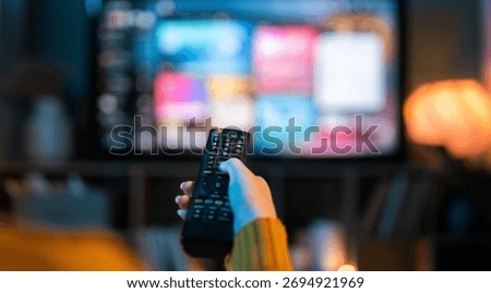 Using remote control while watching tv.