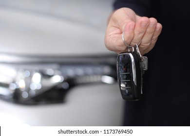 Using  right hand car remote key out the front of  the car  to send for money