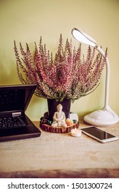 Using semi precious gemstone crystals at workplace desk to boost productivity, block electromagnetic waves, protect from negative energy and attract prosperity concept.