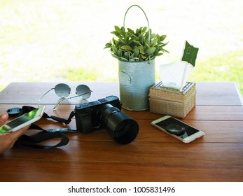 Using Smartphone, Camera And Sunglasses During Vacation. Relax And Wonderlust Travel Concept.