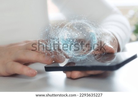 Using smartphone digital technology, global network. Metaverse and Blockchain Technology Concepts. Person with an Experiences of Metaverse Virtual World via Smart Phone. Futuristic bunisess person