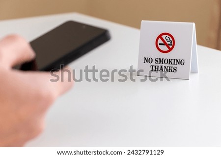 Using a smartphone at a non-smoking table