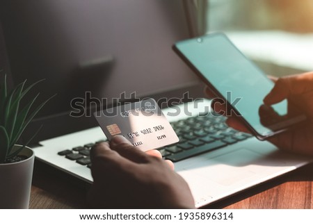 Using smartphone for online shopping. Credit card internet pay.