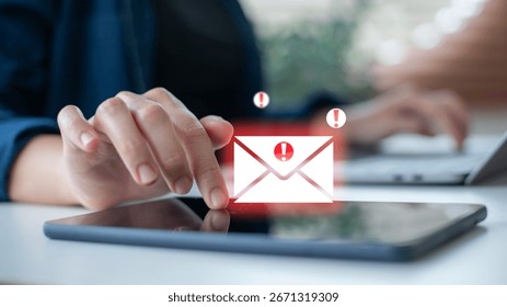 using a tablet with an email security alert icon. Phishing mail, spam warning, cybersecurity threat, online fraud, data protection, and digital safety concept for business communication. - Powered by Shutterstock - Get 15% off with code: PIKWIZARD15