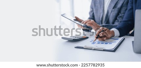 Using tablet pc, Consultant between bookkeepers and accounting lawyer consultation about asset, balance sheet, stock market statistics and yearly tax law, protect business from bribery.
