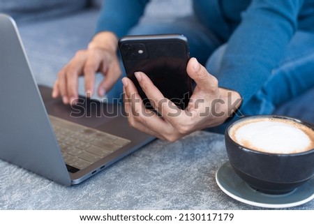 using texting cell phone typing computer.adult professional chatting on laptop,mobile contact us at Thinking business plan.connecting people concept