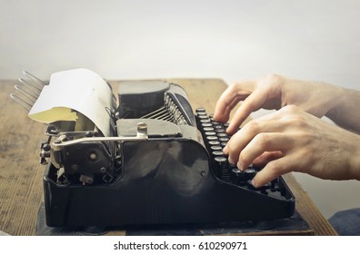 Using a vintage black typewriter