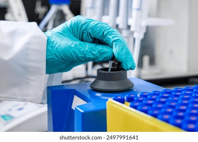 Using a vortex mixer, a chemist agitates samples before conducting HPLC analysis