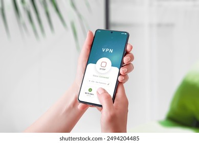 Using a VPN connection app on a smartphone. Highlights mobile security, privacy protection, and secure internet access in a modern digital concept