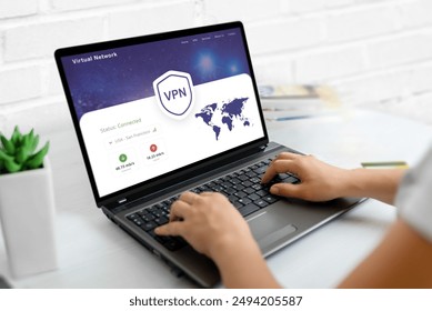 Using a VPN on a laptop. Web page concept with VPN connection and world map, emphasizing global online security and privacy