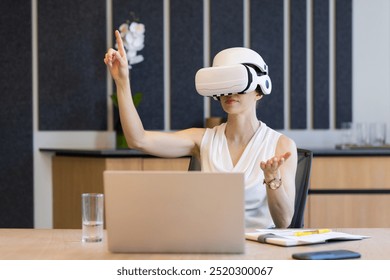 Using VR headset, businesswoman interacting with virtual interface in office meeting. Technology, virtual reality, innovation, workplace, interactive, collaboration - Powered by Shutterstock