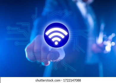 Using WiFi to transfer data. Concept - setting up WiFi equipment for office. Telecommunication services. Man clicks on the WiFi logo. Concept - company provides Internet configuration services