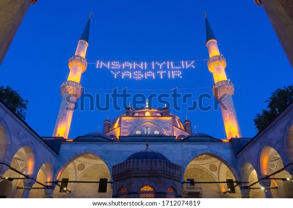 \
Uskudar Istanbul. 30 June 2016 Üsküdar New Valide\
Mosque, also known as Valide-i Cedid Mosque. Ramadan month fasting\
time social message on mosque ridge.  doing favor will make people\
live.