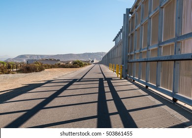 The US-Mexico Border Wall Separating San Diego, California And Tijuana, Mexico