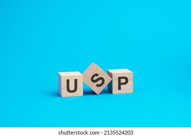 USP text on wooden blocks, financial business concept, blue background. USP - short for Unique Selling Proposition - Shutterstock ID 2135524203