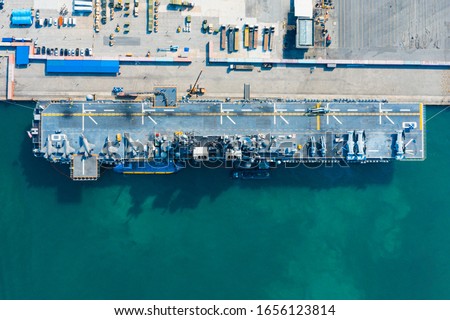 USS America. Navy aircraft carrier Aerial top view of battleship, Military sea transport, Military Navy Rescue Helicopter on board the battleship deck, Amphibious Assault Ship