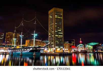The USS Constellation and World Trade Center at night, in the Inner Harbor of Baltimore, Maryland.
